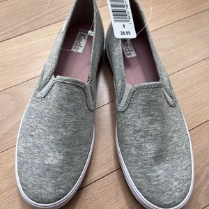 Brand new size 8 grey fabric slip on keds
